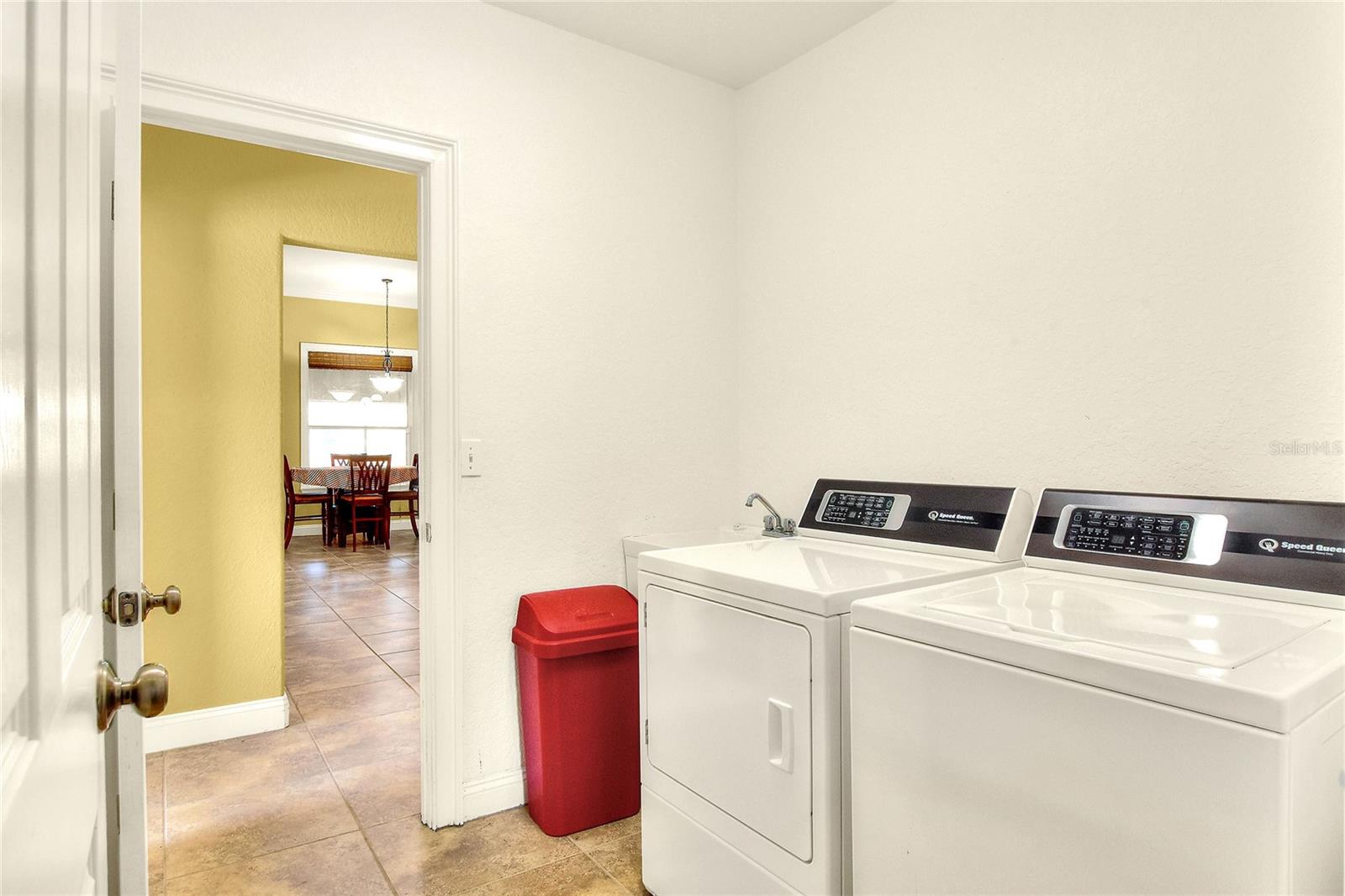 Laundry room. Washer and dryer conveys with the sale.