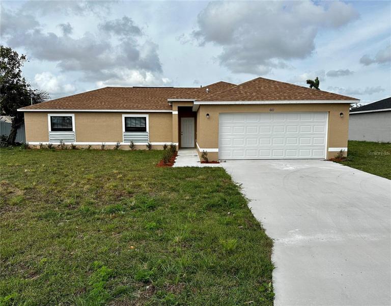 601 SE 2nd St, Cape Coral, FL 33990 -Front lawn and Garage