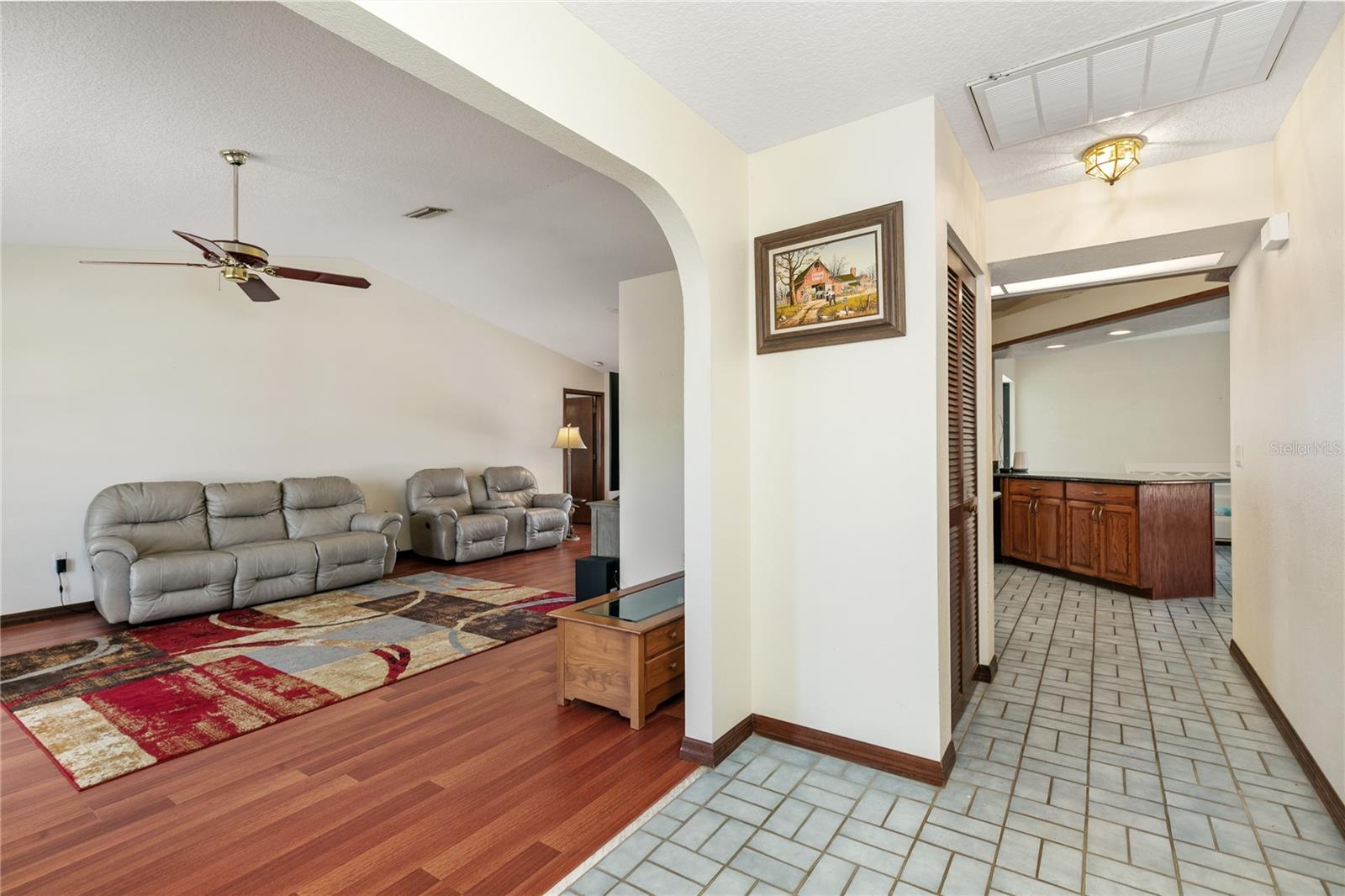 Entry viewing into the house, Living room to the left and hallway into Kitchen
