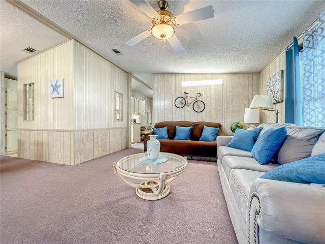 Living room with view into the dining room