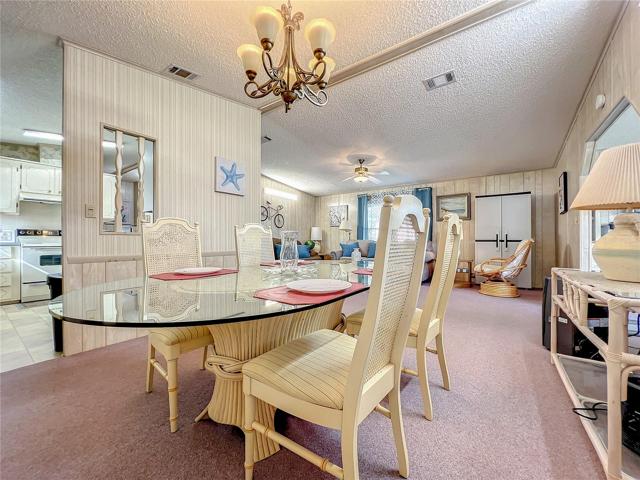 Dining room has lots of storage with the built-in shelving