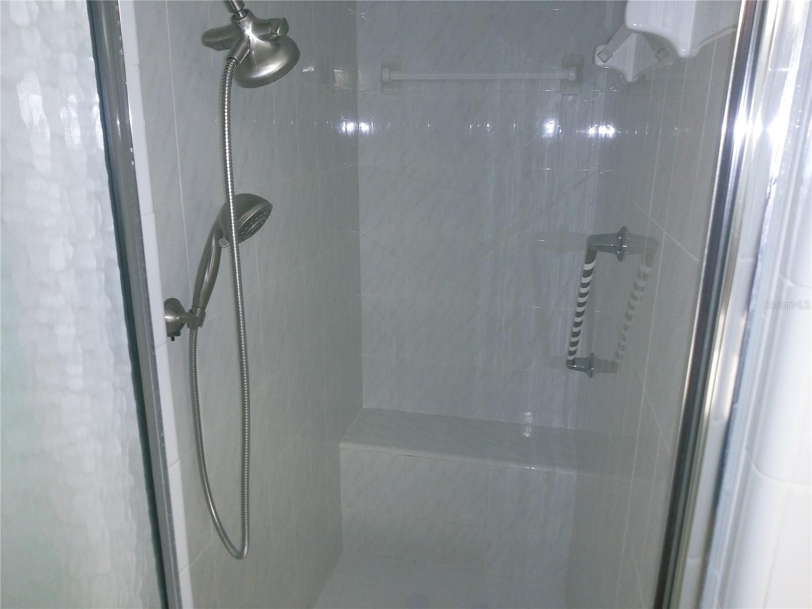 Master bathroom tiled shower.