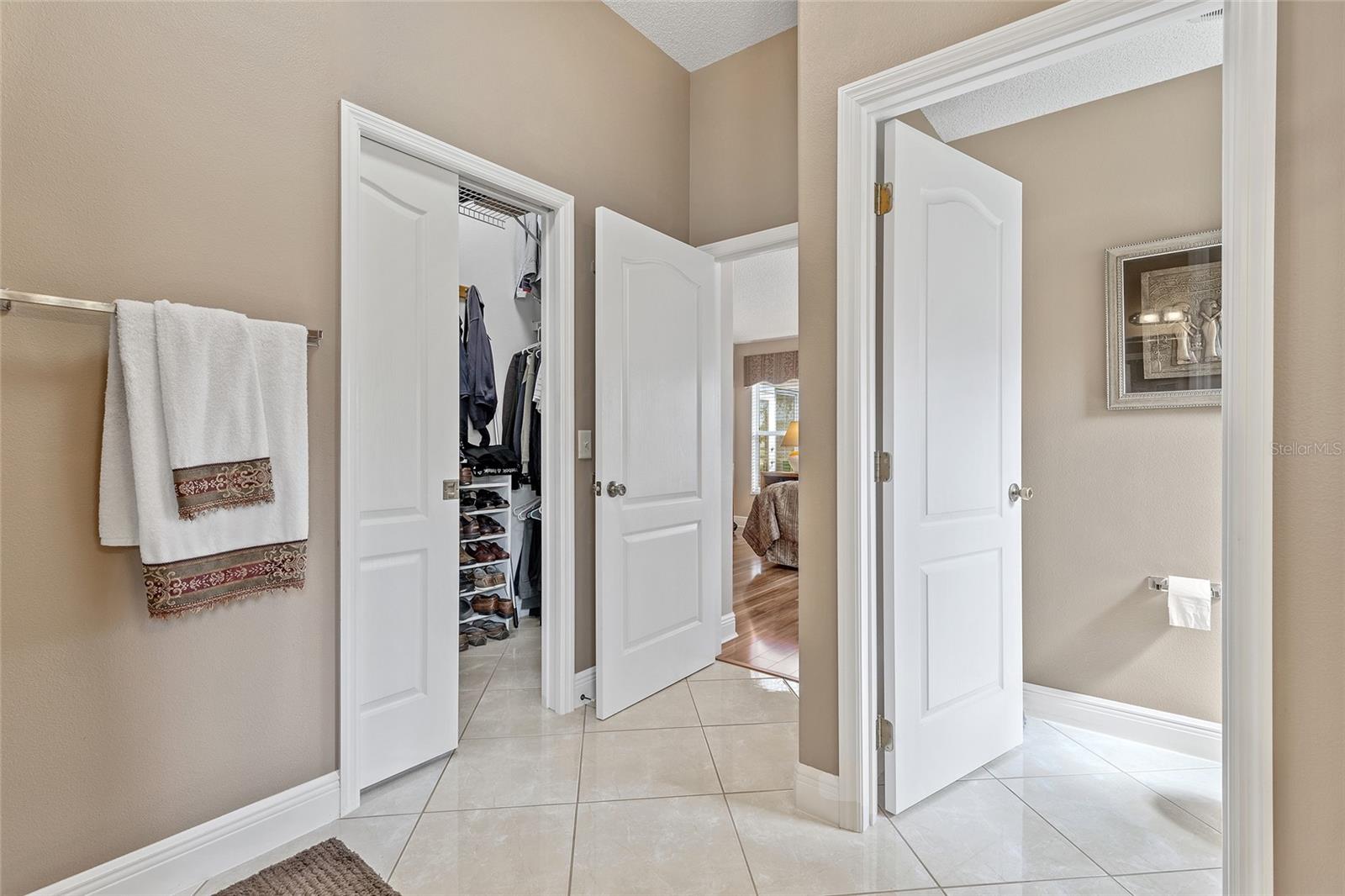 ENTRANCE TO THE WALK-IN CLOSET AND EN SUITE MASTER BATH