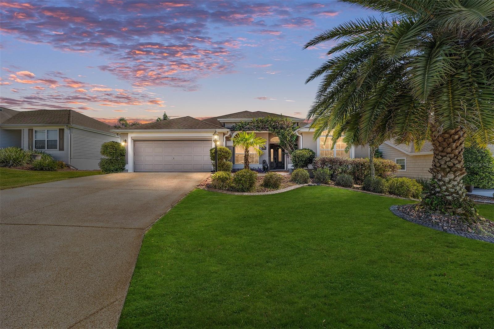 LOVELY GARDENIA DESIGNER WITH CHATTAHOOCHEE RIVER ROCK DRIVEWAY - NICE CURB APPEAL! THIS IS AN OVERSIZED 2 CAR GARAGE!