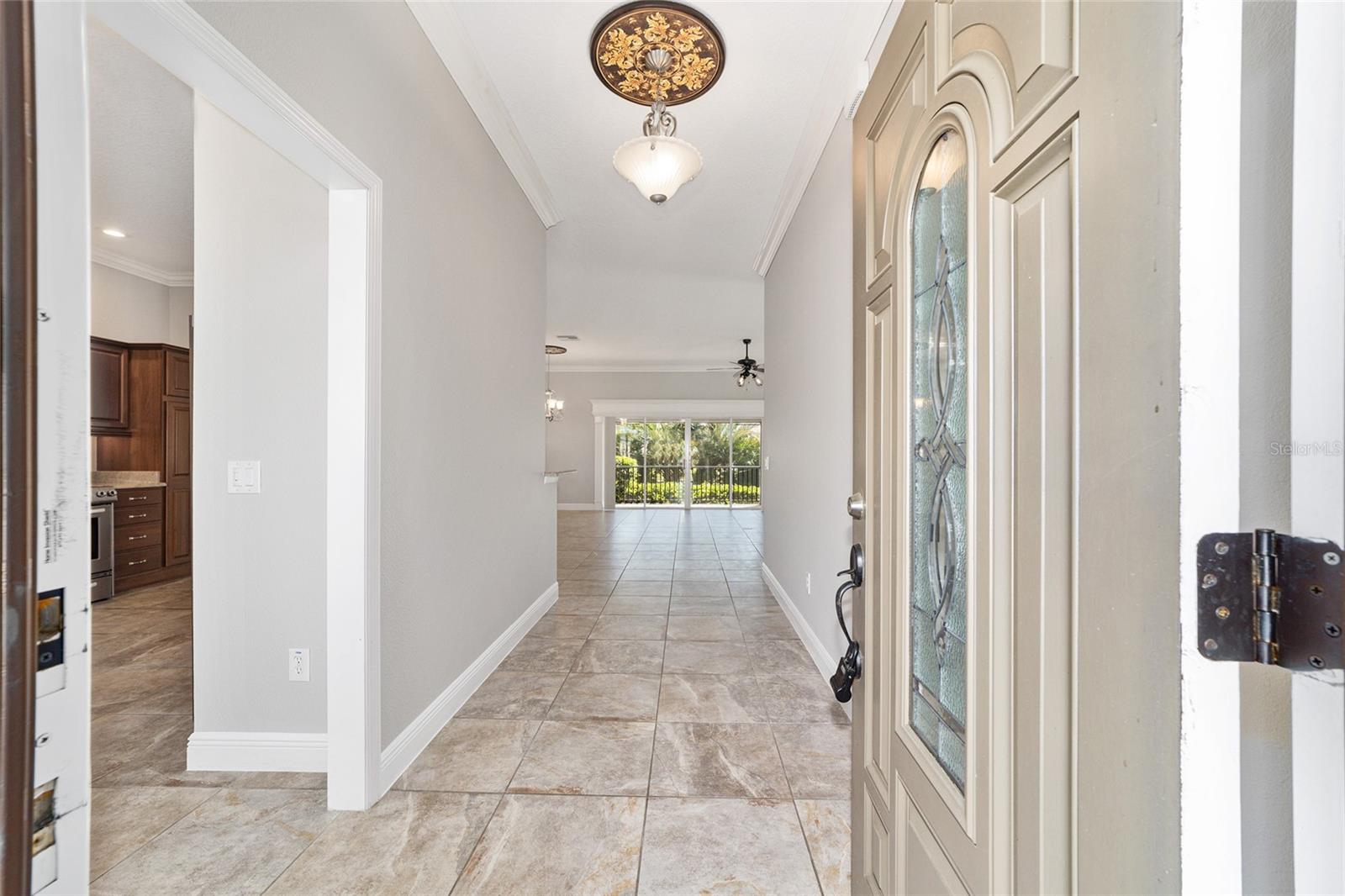 WELCOME!  LOVELY TILE FLOORING THROUGHOUT THE LIVING, DINING, KITCHEN, HALLWAYS AND BATHS WITH NEW CARPET IN THE BEDROOMS! INTERIOR FRESHLY PAINTED!