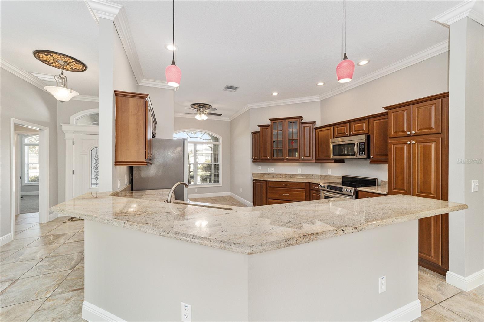 BREAKFAST BAR FOR CASUAL DINING WITH PENDANT LIGHTING!
