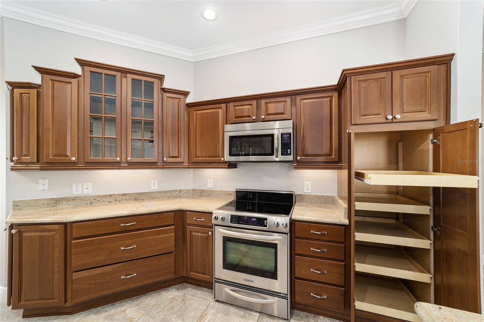 ALL UPGRADED KITCHEN AID STAINLESS APPLIANCES! DOUBLE DOOR PANTRY WITH PULL OUT DRAWERS!