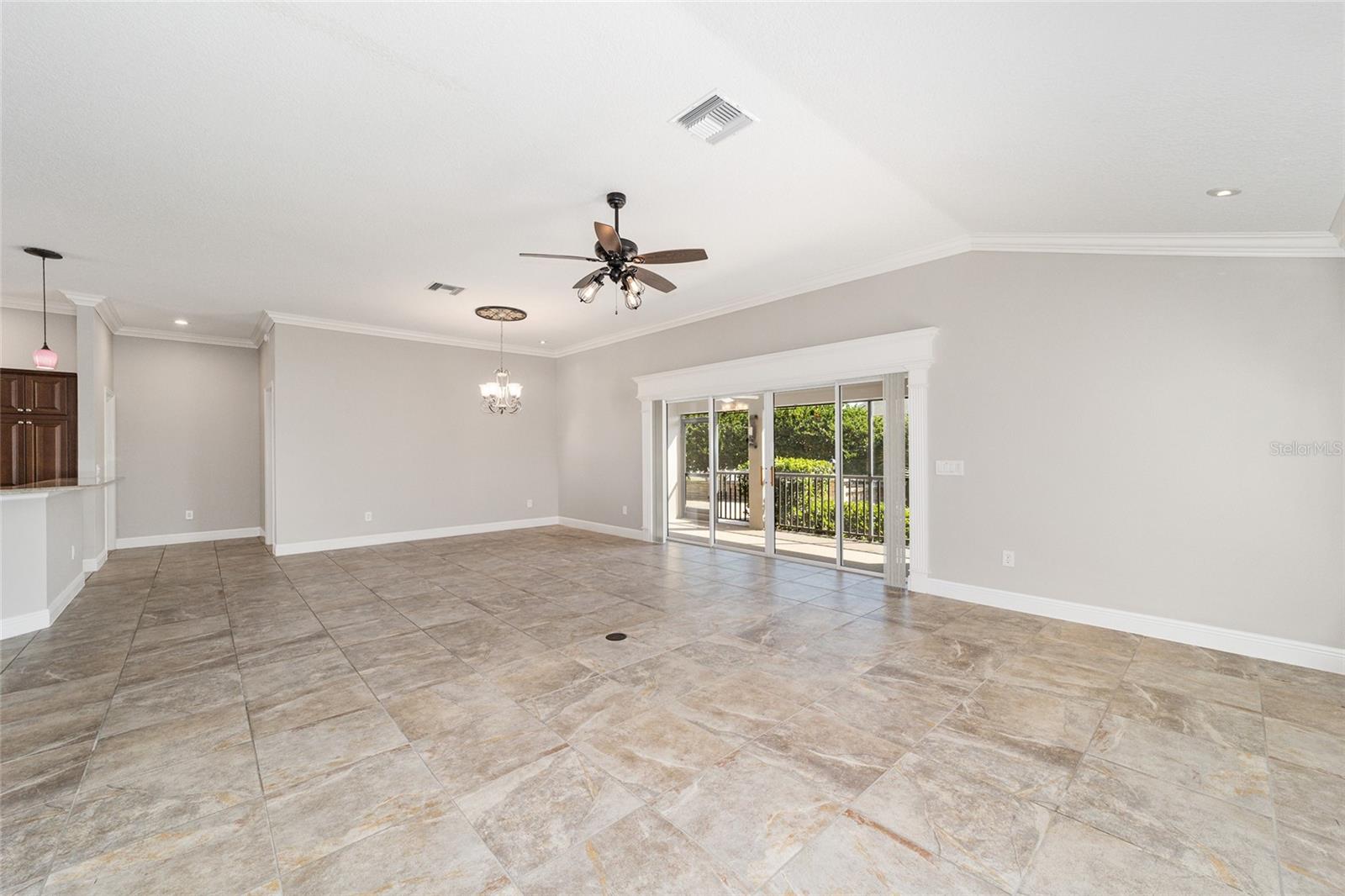 WOOD CORNICE OVER THE STACKBACK SLIDING GLASS DOORS THAT OPEN OUT TO THE LANAI!