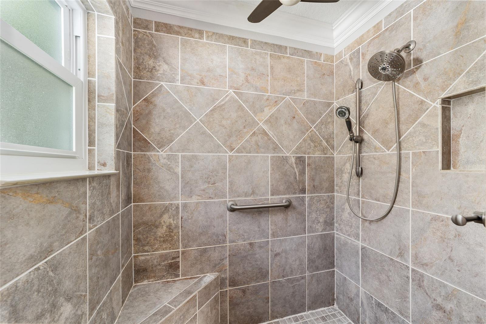 SPACIOUS ROMAN SHOWER WITH WINDOW!  THERE IS EVEN CROWN MOLDING IN THE SHOWER!