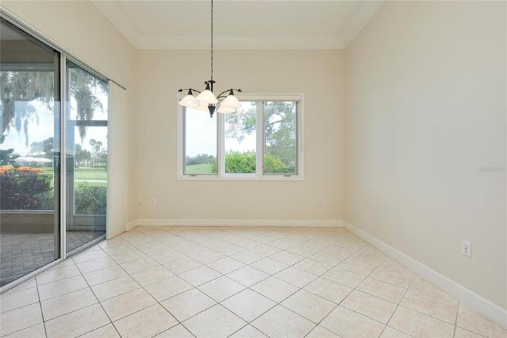 Dining area  with golf and water view