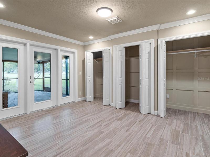 Bedroom #4 with access to screen porch #2. 