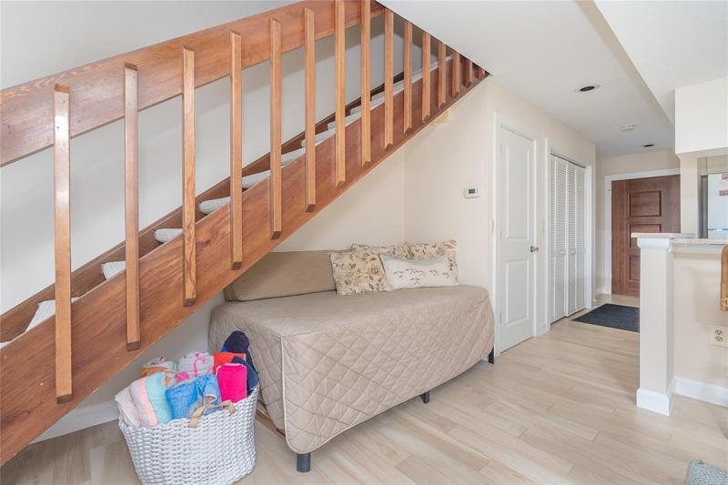 Bed under Stairs in Living Area.