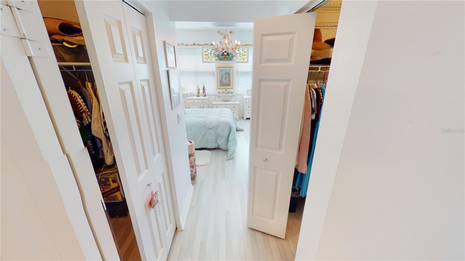 Primary bedroom with 2 walk-in closets