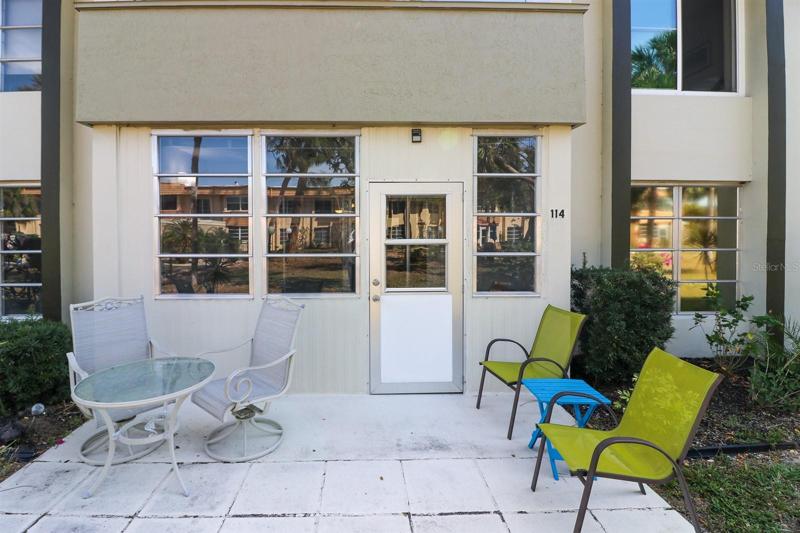 Back porch is shaded by the trees and offers a great spot to relax in the fresh air.