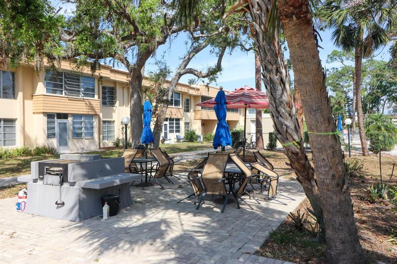 Grills and table and chairs with umbrellas is a favorite gathering place.