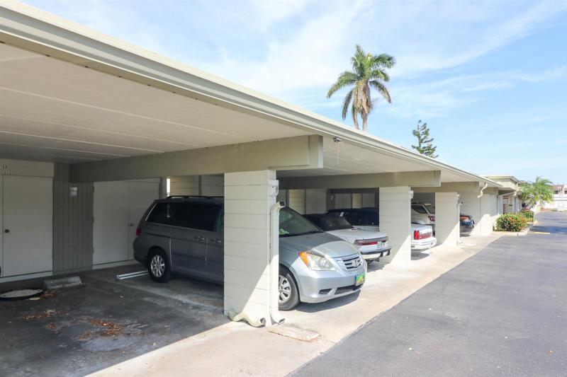 Deeded carport parking with storage at the back of each space.  Carport is block construction.