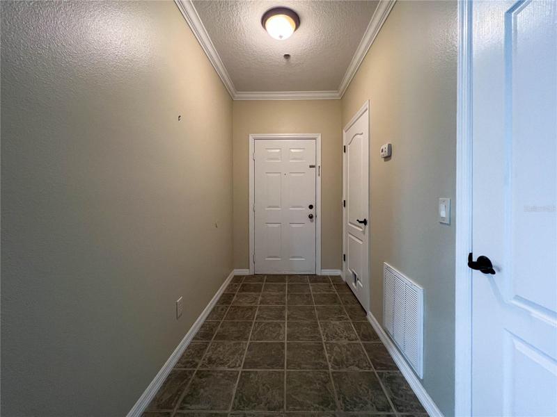 LARGE WELL-LIT SPACIOUS FOYER WITH DELUXE TILE FLOORING... YES!!!