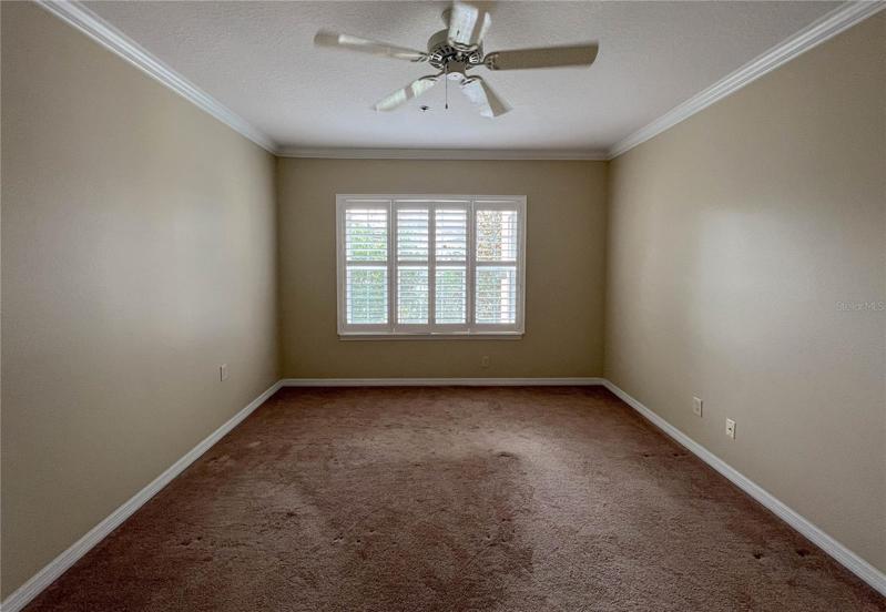 MASTER BEDROOM. ENJOY PRIVACY PLUS NICE VIEWS OUTSIDE... CROWN MOULDINGS, PADDLE FAN, BAHAMA SHUTTERS... CLASSY!