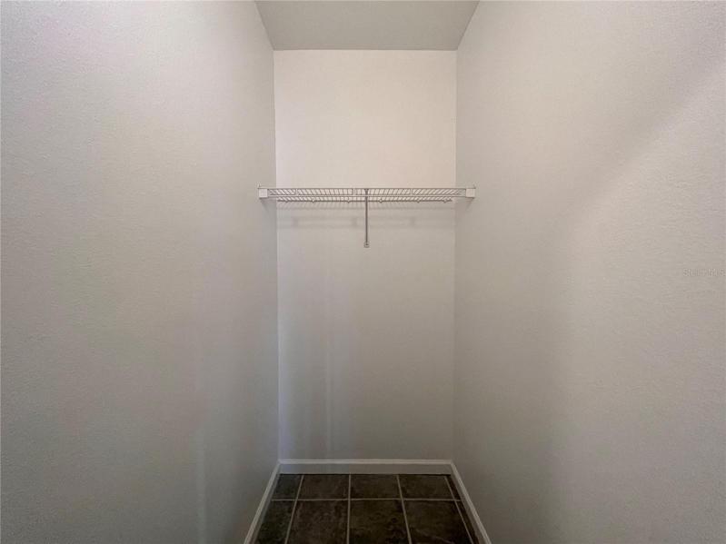 WALK-IN STORAGE CLOSET WITH TILE FLOOR... SPACIOUS STORAGE THROUGHOUT, TOO.
