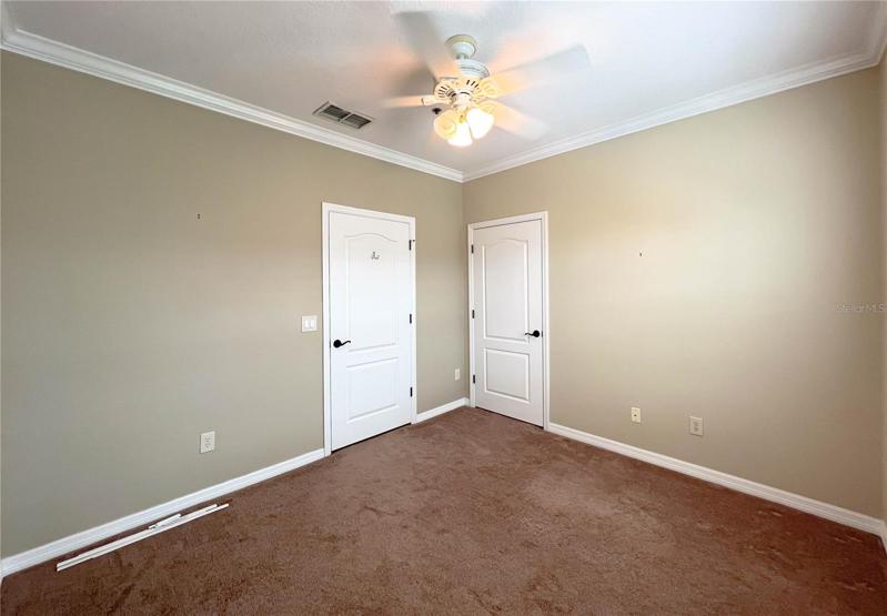 2ND BEDROOM HAS HIGH CEILINGS WITH CROWN MOULDINGS AND CLEAN CARPETING FOR SOFT LANDINGS! HA!
