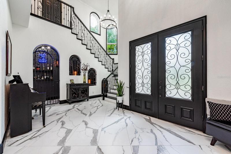 NOT TO BE MISSED HIGHLIGHTS OF THE MAIN HOME; a light and bright open concept with soaring ceilings, top of the line finishes, lake views, a gourmet kitchen with everything a home chef could ask for!