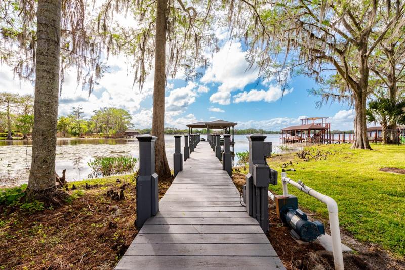 When you are not relaxing poolside, this property makes it easy to enjoy the lake life with a private boat ramp to take your boat in and out of the lake, dock with power lifts for your boat and jet skis!