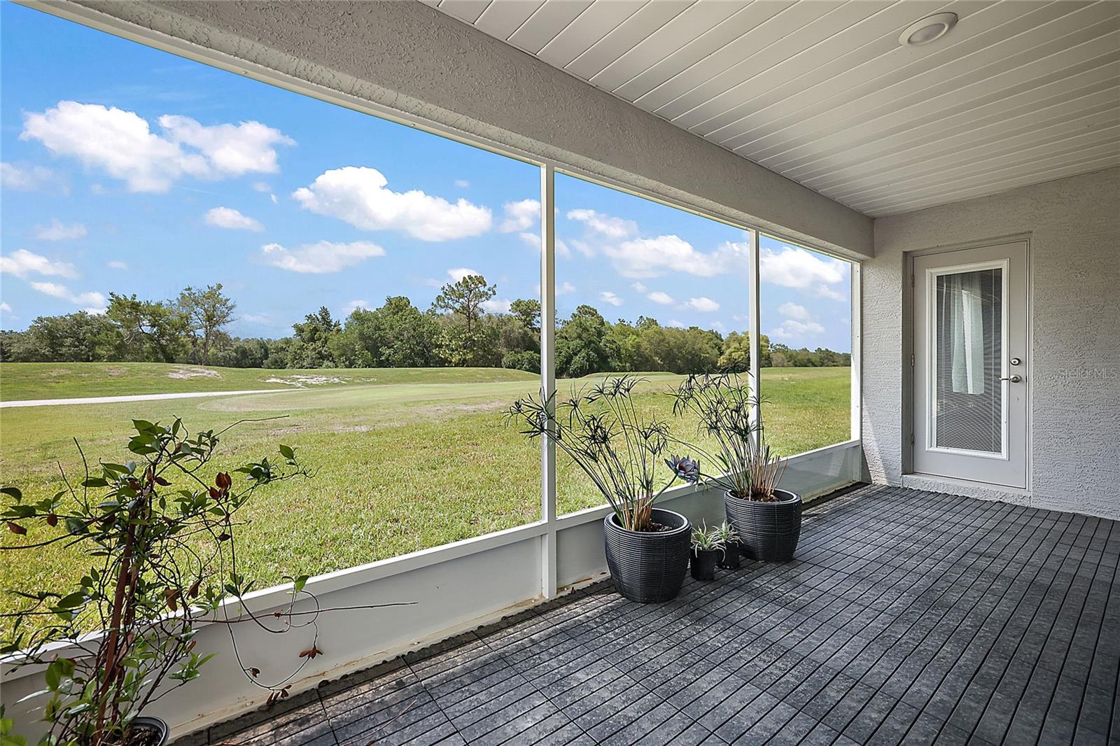 SCREENED LANAI, VIEW OF GOLF COURSE