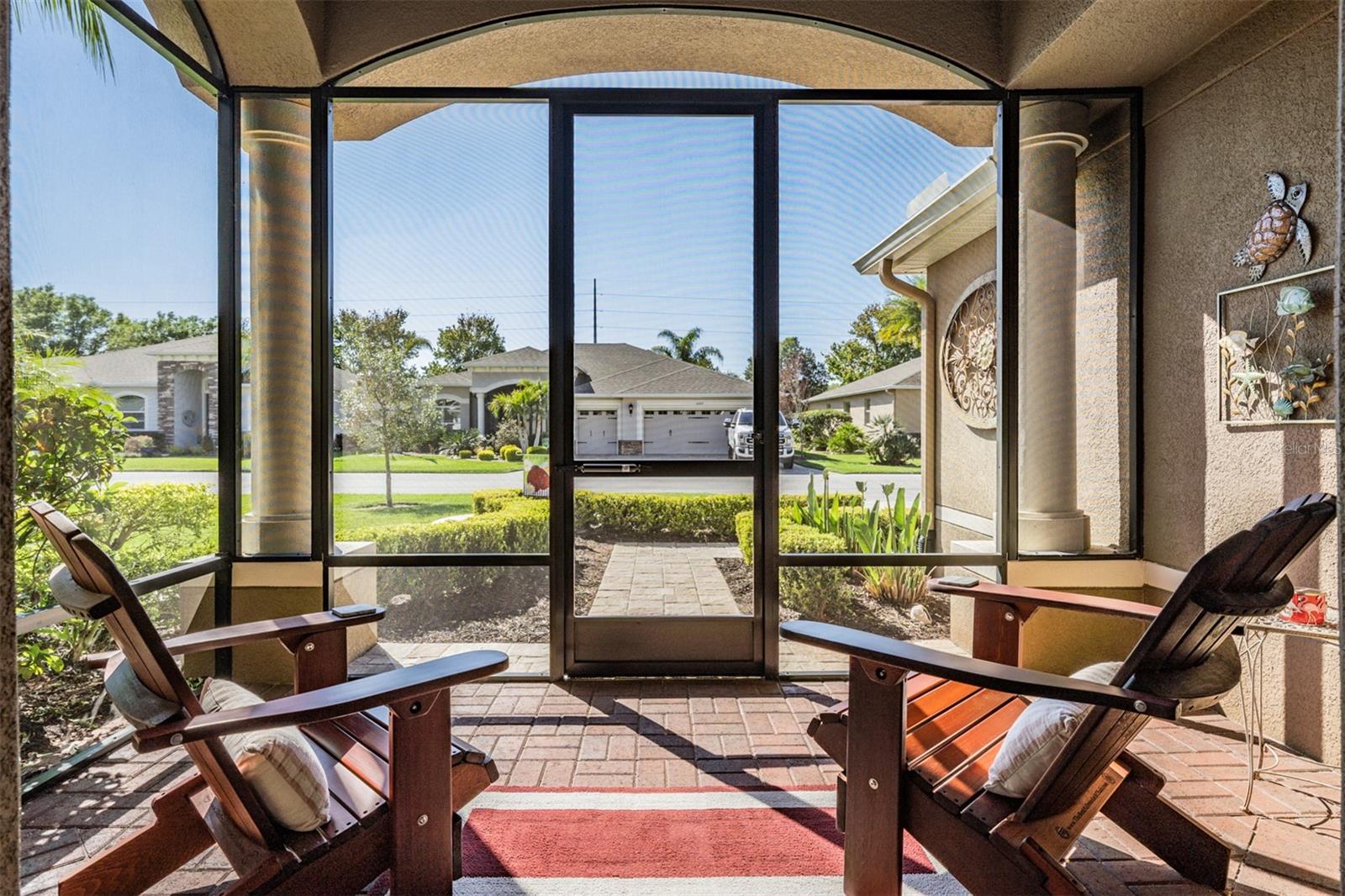 Screened front LANAI  with Paver floor and new screens WELCOMES you!