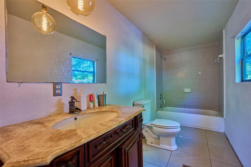 Upgraded vanity and pendant light in master bath