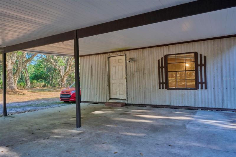 Carport at the rear of the home
