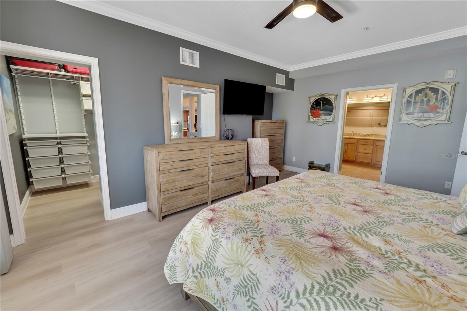 Master Bedroom with view of walkin closet with great storage set up
