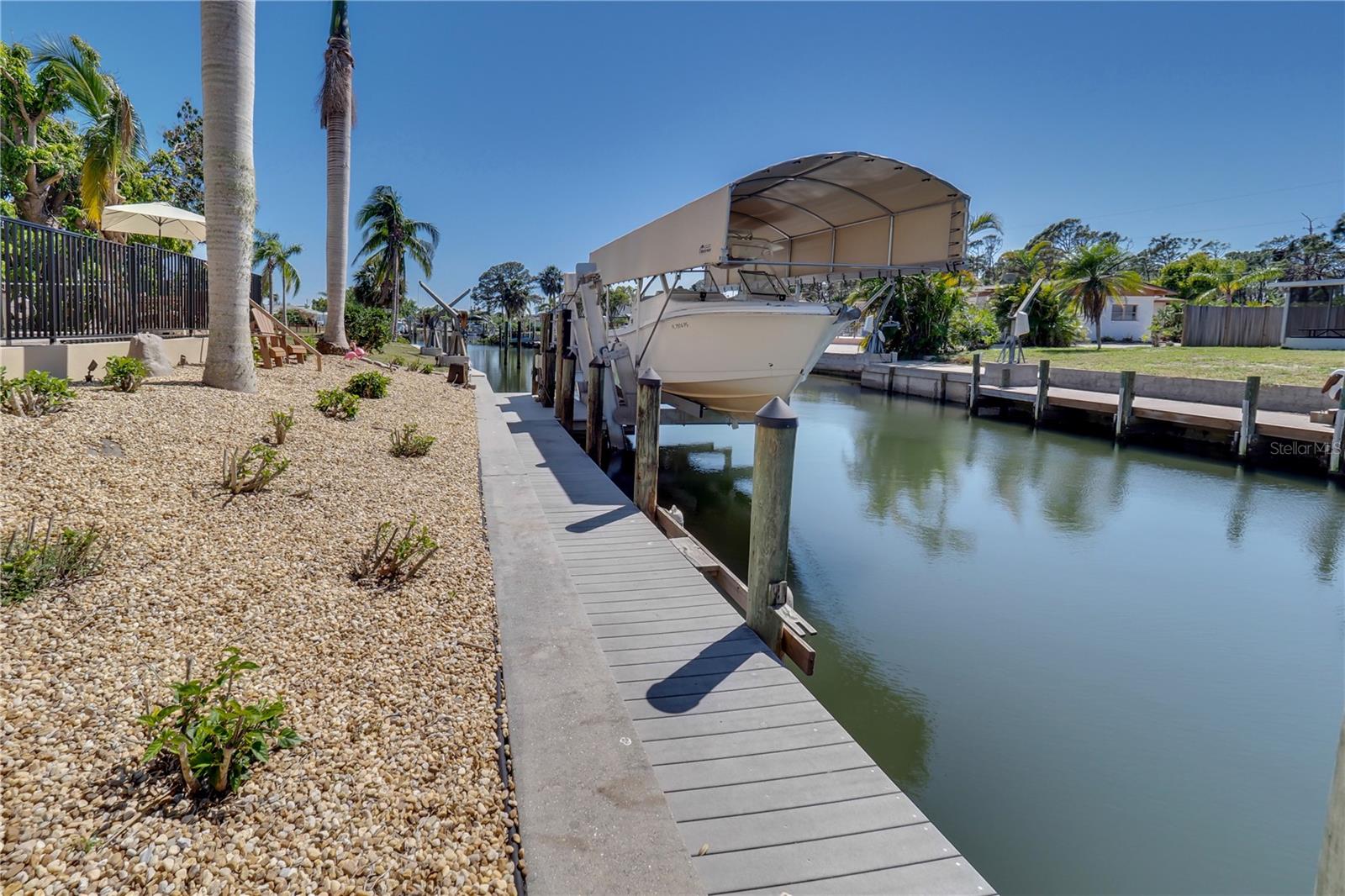 Canal goes out to Lemon Bay and Stump Pass.  No bridges   