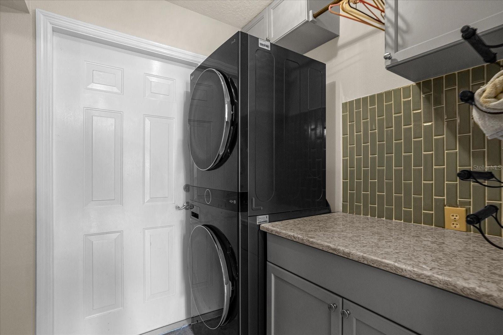 Laundry room with nearly new stackable W/D