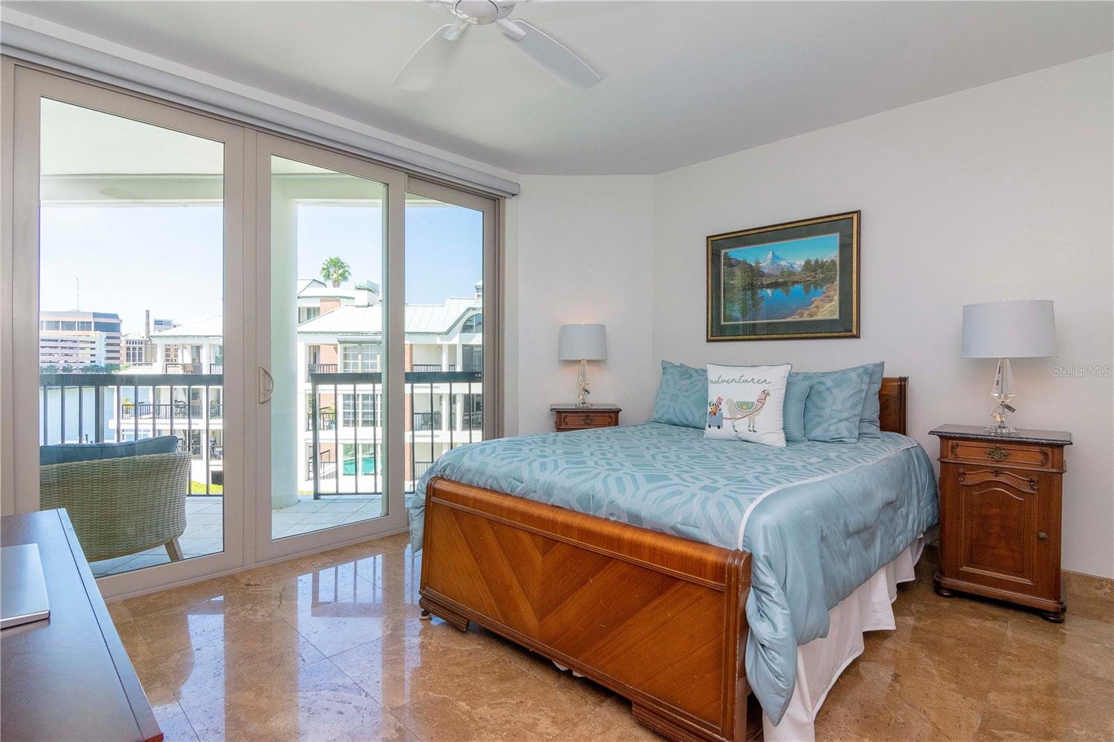 Bedroom 2 is located on the first floor with large sliders leading out to the wrap around balcony