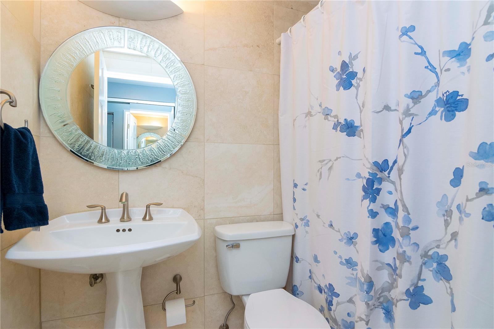 This full bath is right outside the third bedroom