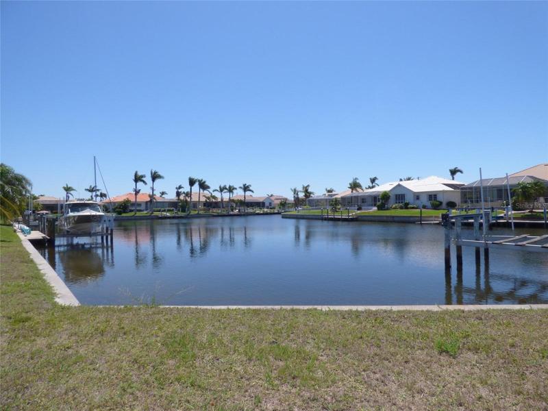 This photo was taken from the adjacent property.  Note the wider basin view allows for easier turning around when mooring your boat.