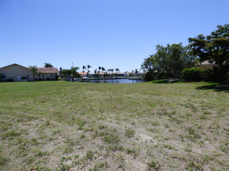Photo taken from the road looking towards the waterfront.  This lot will accommodate a larger home, pool and 3 car garage!  Ask agent for suggested builders.