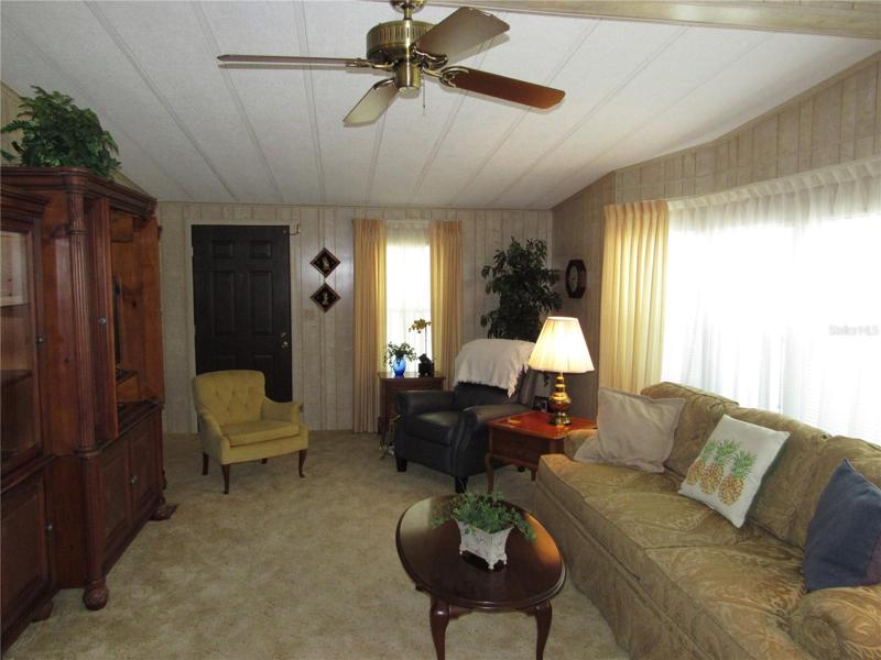 Living room with entry door.