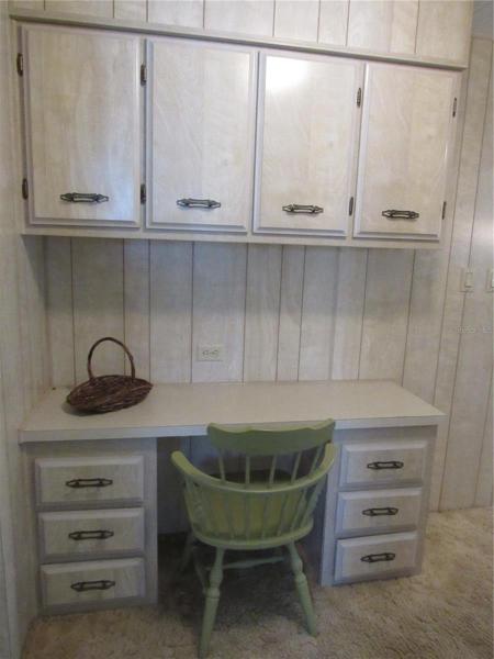built-in desk and storage cabinets.