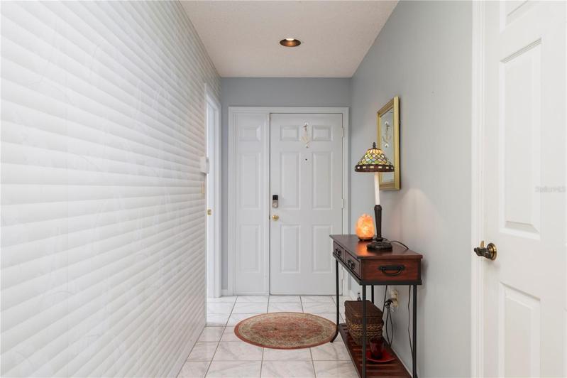 Foyer/hall has wallpaper