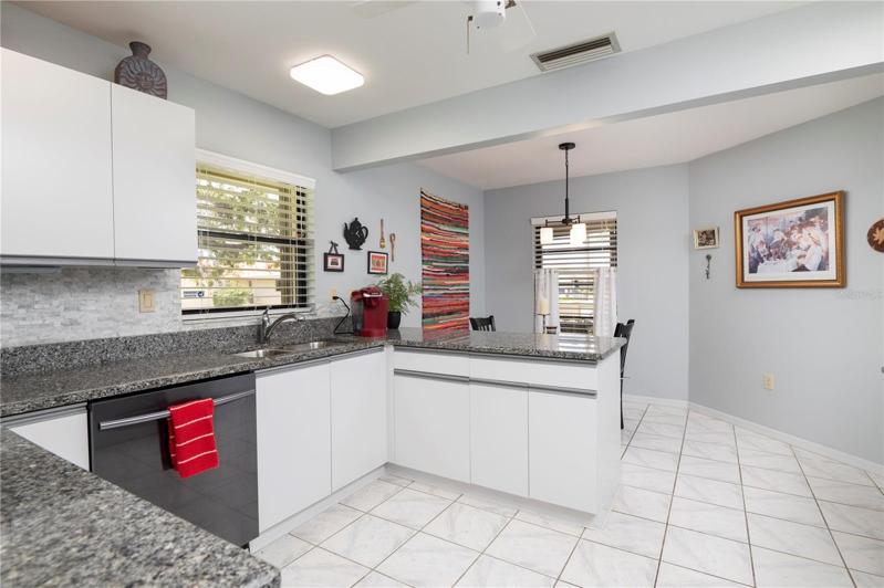 Large kitchen has extra cabinets and counter