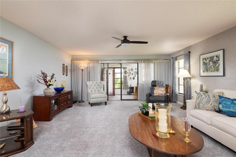 Living room toward dining and kitchen
