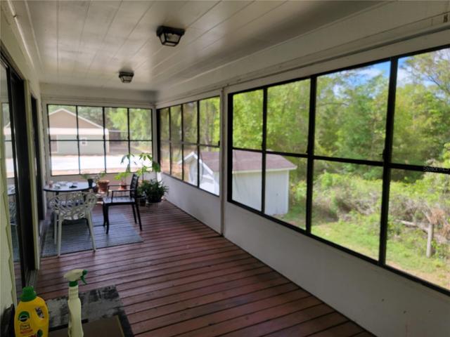 Upstairs covered screened in porch