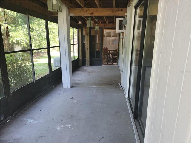 Downstairs covered screened in porch
