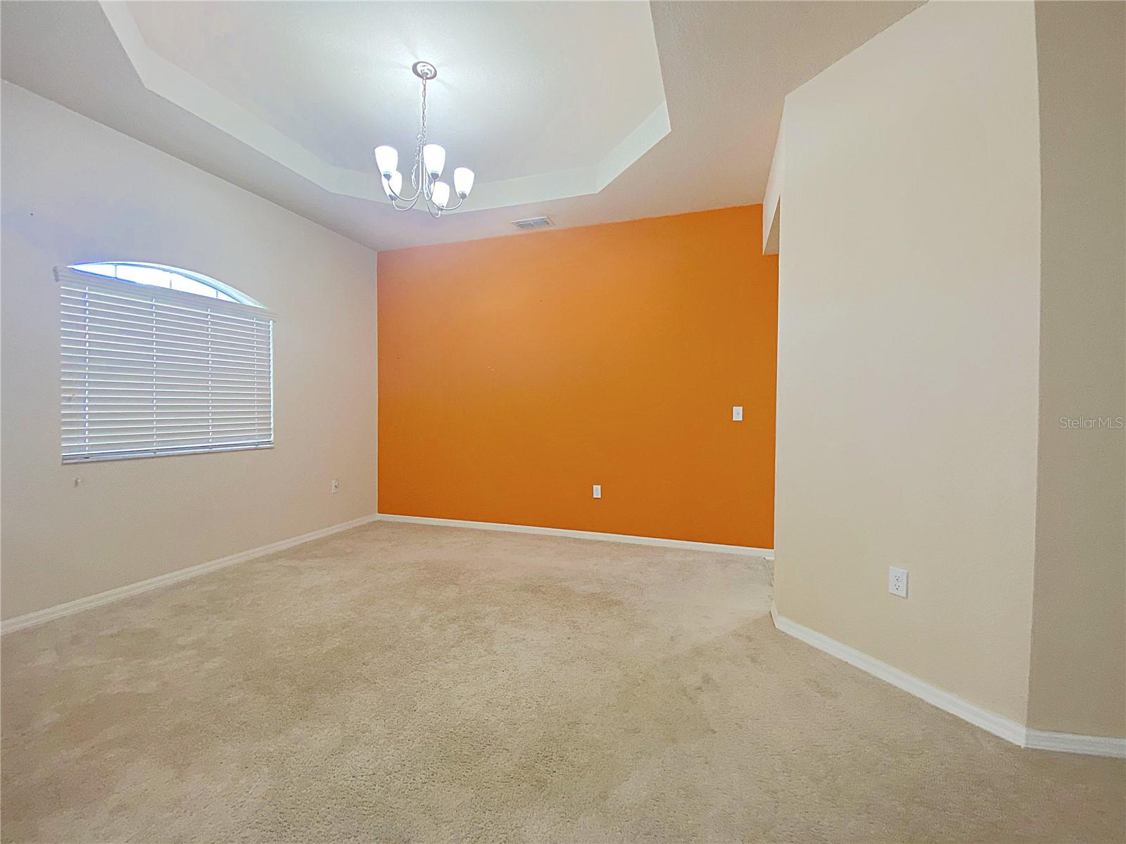 Formal dining room offers an accent wall