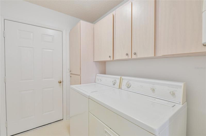 Inside Laundry with Cabinet Storage