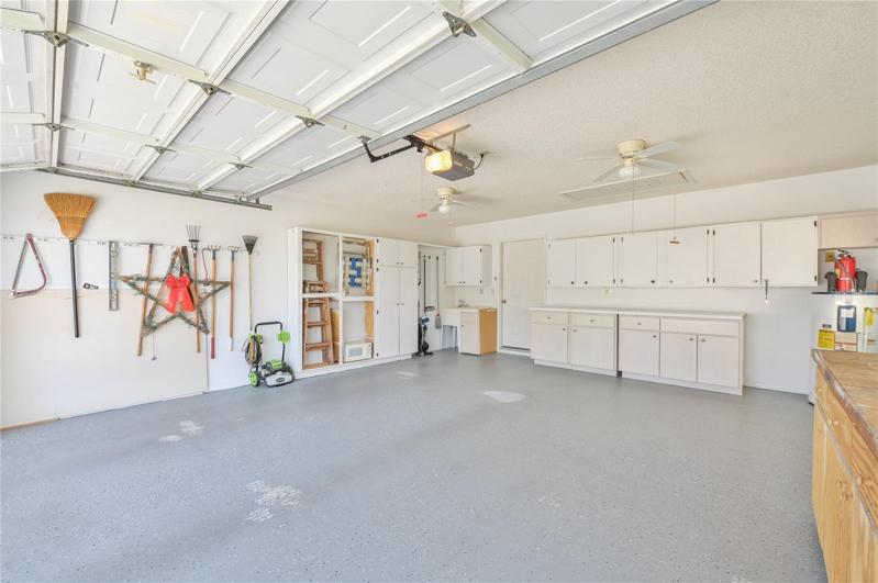 Garage with Ceiling Fan & Attic Stairs