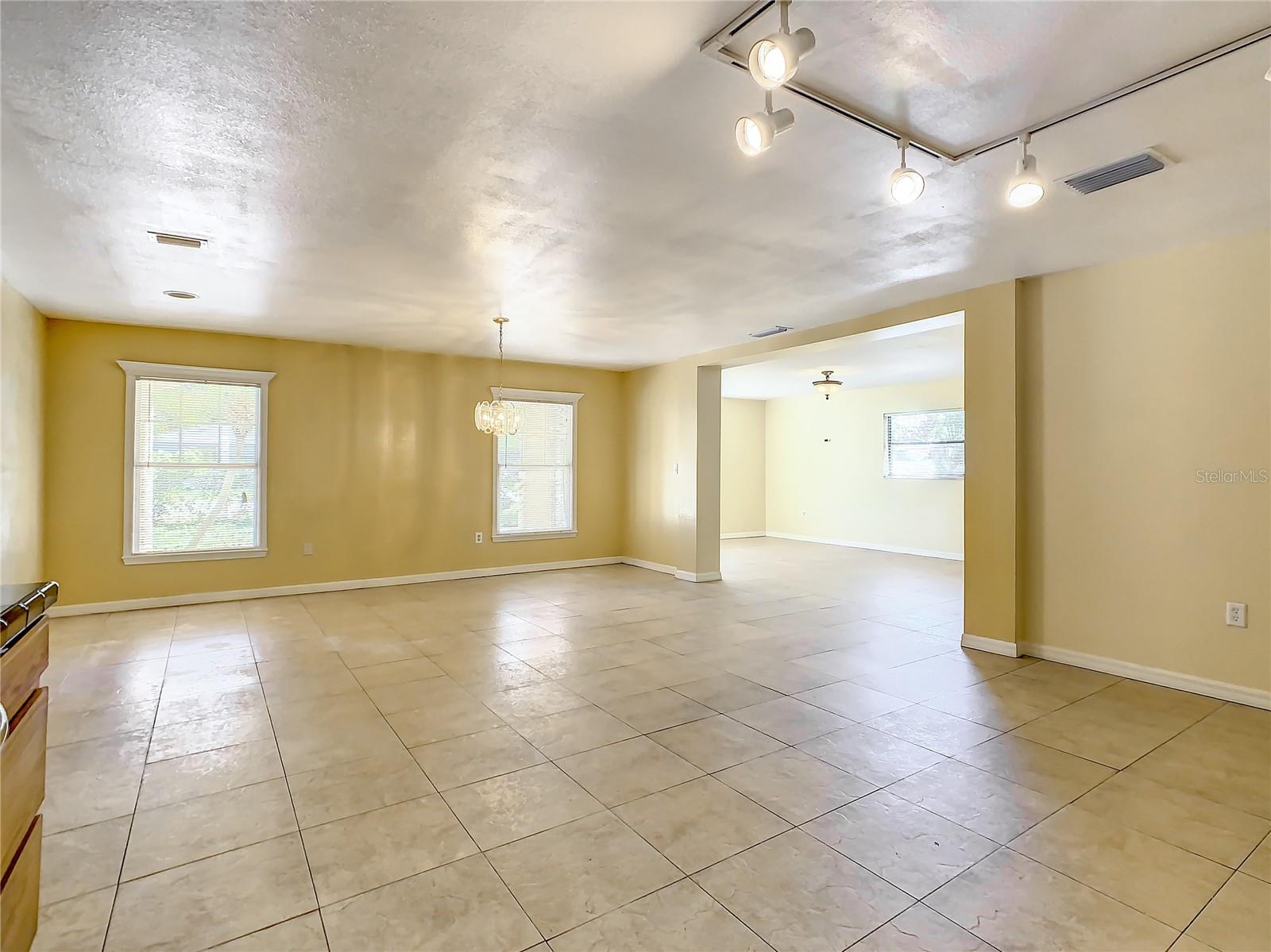 Another view looking from the Kitchen into the Dining Area and the Living Room