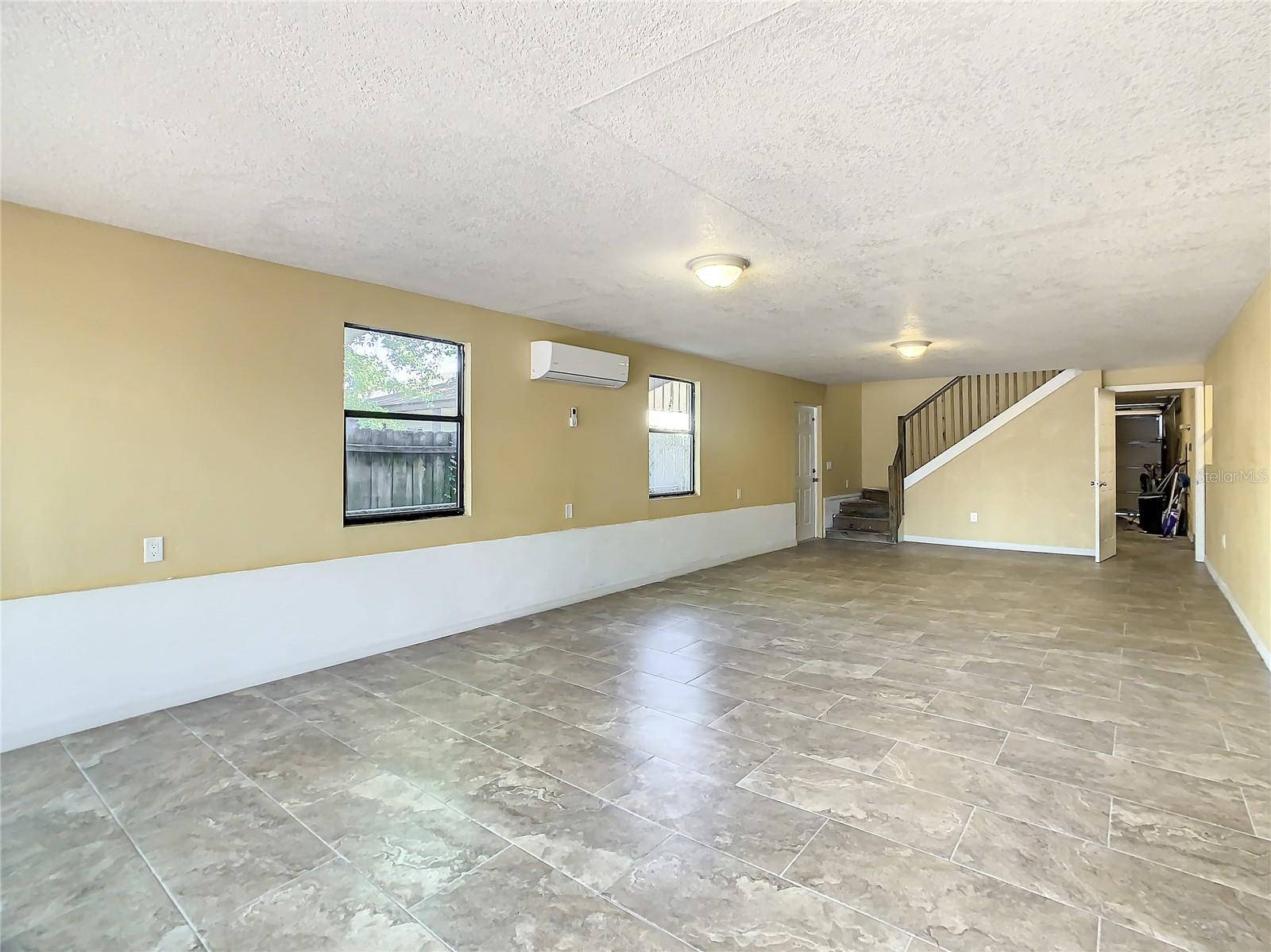Another view of the downstairs Great Room also exterior side door access.