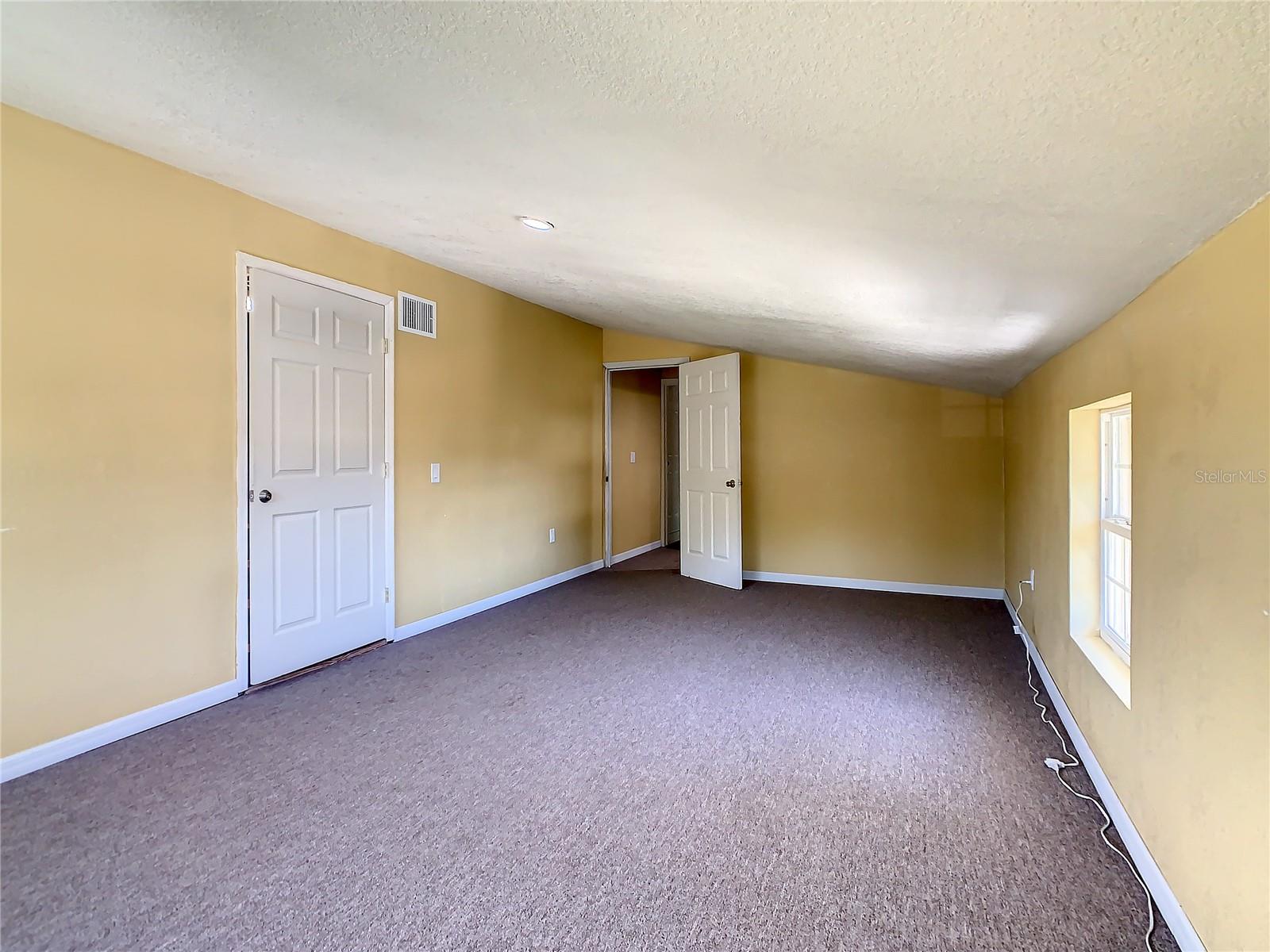 Another view of the upstairs Bonus Room with Attic Access